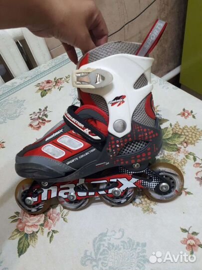 Роликовые коньки