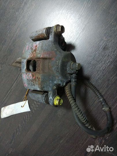 Суппорт левый Mitsubishi Dingo 1998-2002 CQ2A 4G93