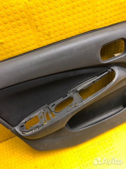 Обшивка двери передняя левая Nissan Almera Classic