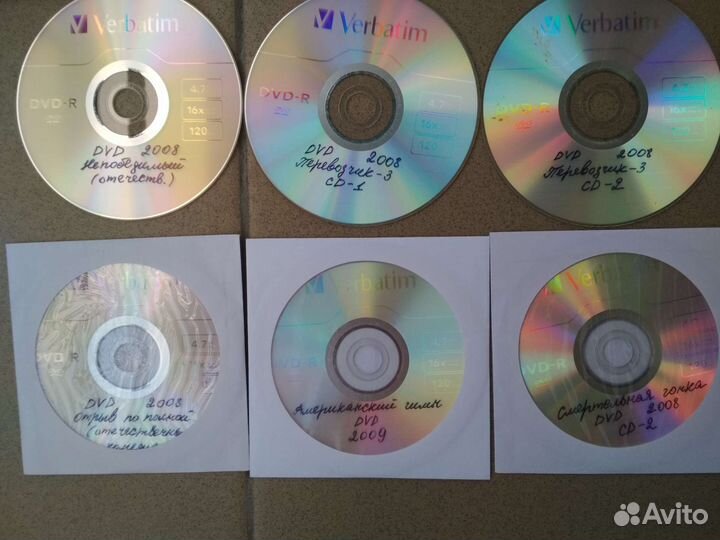 CD с фильмами и дискеты пакетом