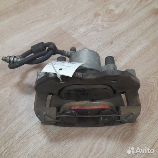 Суппорт тормозной передний левый Mazda 3 BK