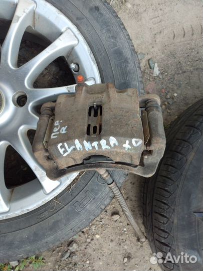 Суппорт передний правый Elantra XD