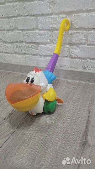 Каталка пеликан поющая