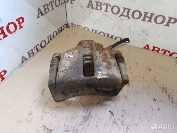 Суппорт тормозной передний левый Volkswagen Caddy