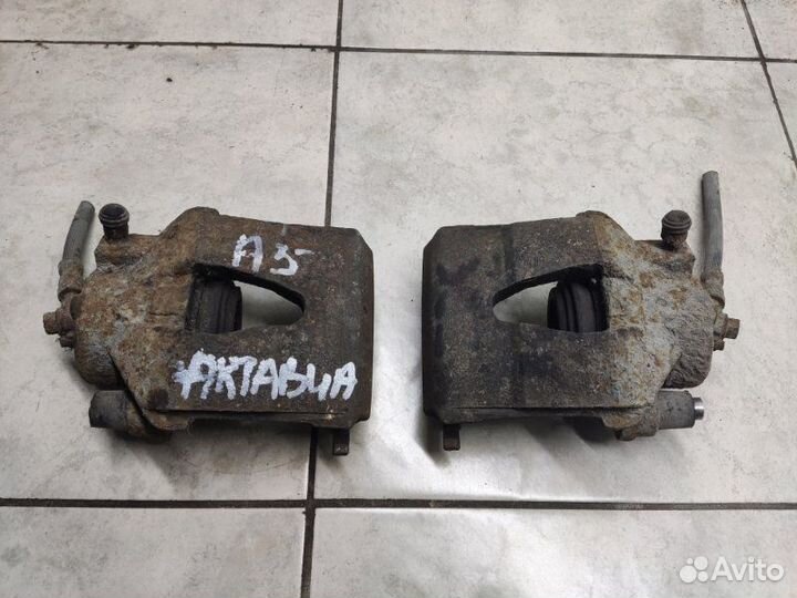 Суппорт тормозной передний Skoda Octavia А5 1.6