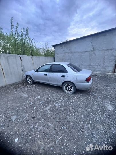 Mazda Familia 1.3 AT, 1996, битый, 250 000 км