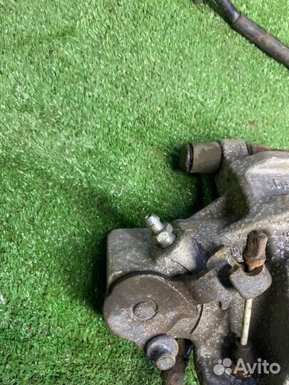 Суппорт тормозной задний левый Mazda 3 BL Z6 2011