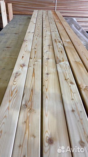 Лиственничная обшивка фасада с косыми планками