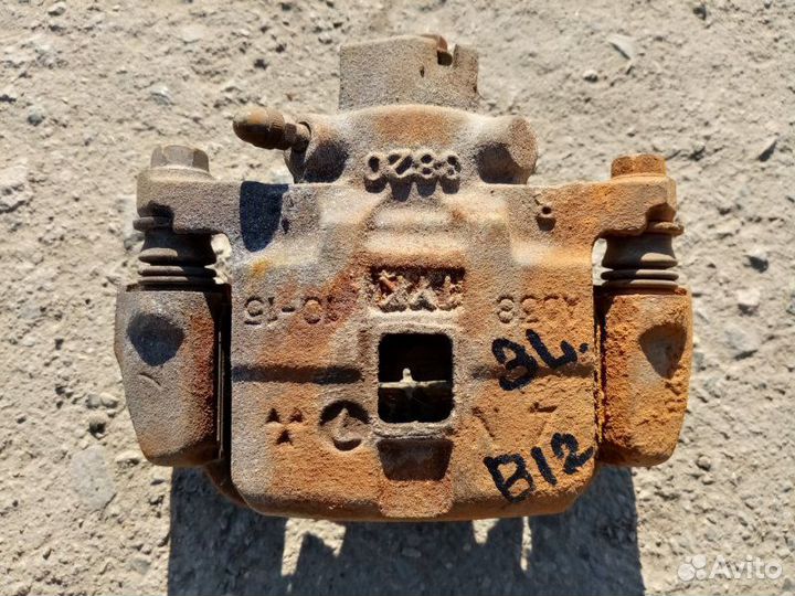 Суппорт задний левый Subaru Legacy Outback B12