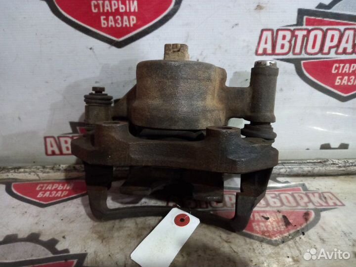 Суппорт тормозной передний левый Nissan Skyline