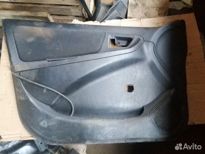 Обшивка двери передней левой Geely MK 2008-2015