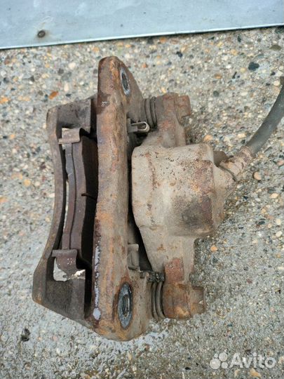 Суппорт тормозной передний левый Kia Spectra S6D