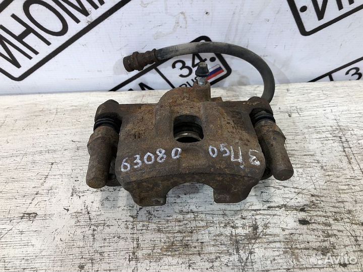 Суппорт тормозной задний Mitsubishi Lancer 9