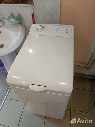 Стиральная машинка с вертикальной загрузкой