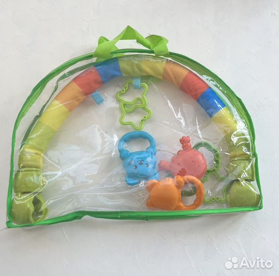 Дуга с игрушками на коляску