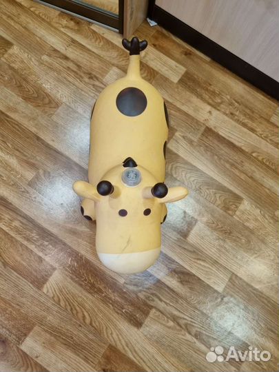 Игрушка прыгалка музыкальная Корова Жираф