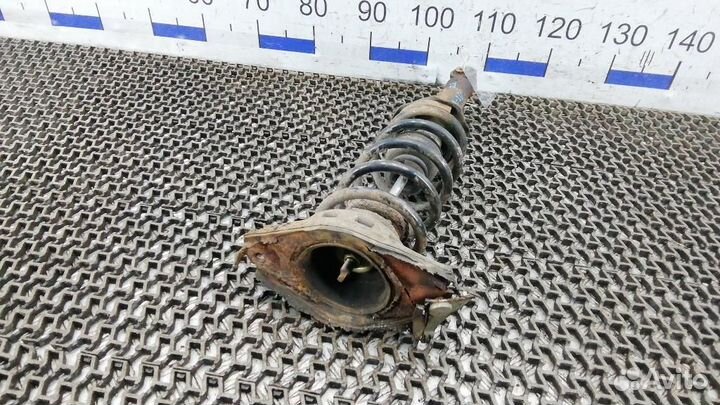 Стойка амортизатора заднего левого Nissan Almera