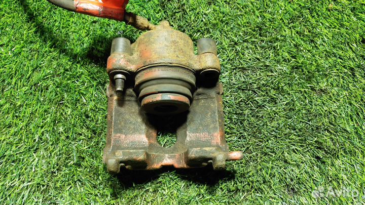 Суппорт тормозной Opel Astra F