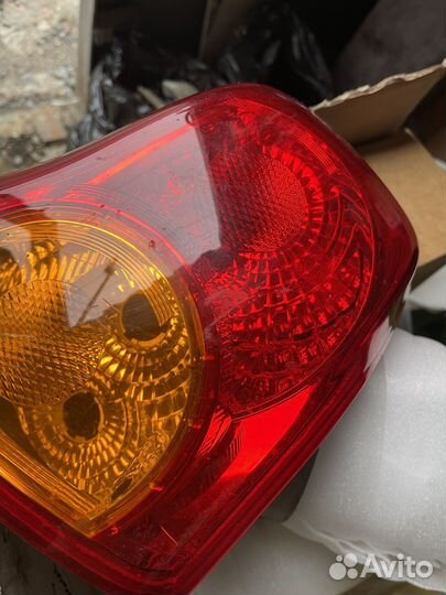 Фонарь задний левый Toyota Corolla E150 оригинал