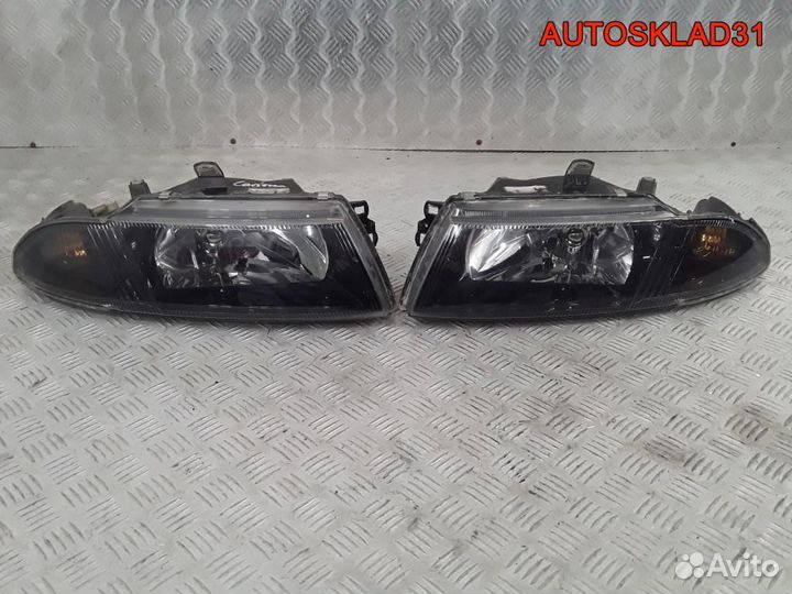 Фара левая правая Mitsubishi Carisma DA MR972793