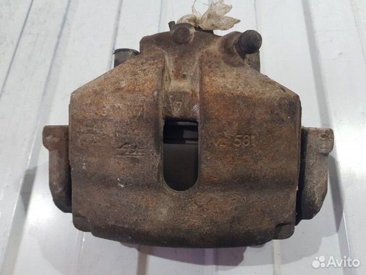 Суппорт тормозной передний левый Volkswagen Polo