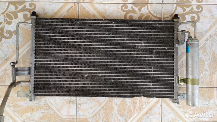 Радиатор кондиционера на Mazda demio