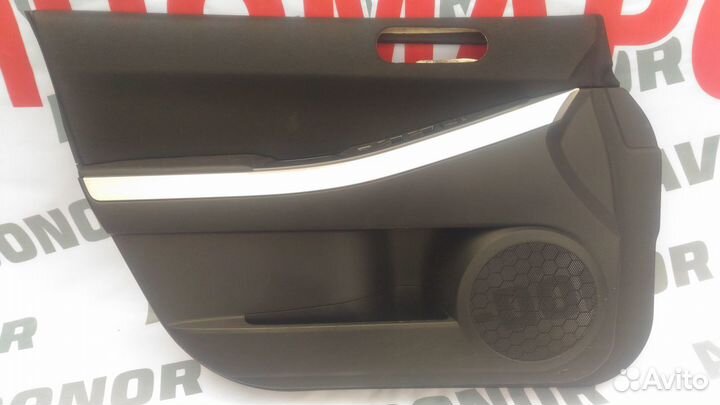 Обшивка двери Мазда сх 7