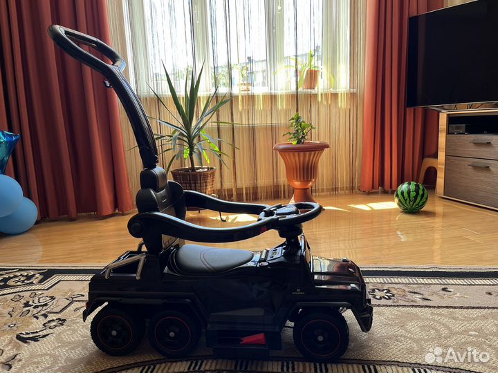 Машинка-каталка электрическая
