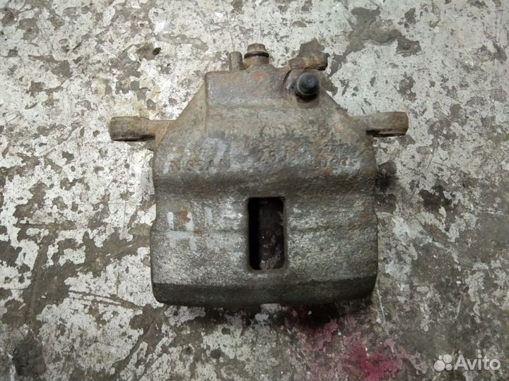 Суппорт тормозной передний Ниссан Альмера N16