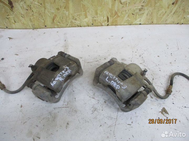 Суппорт передний Шевроле Лачетти