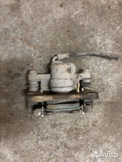 Суппорт задний левый (Chery Tiggo T11)