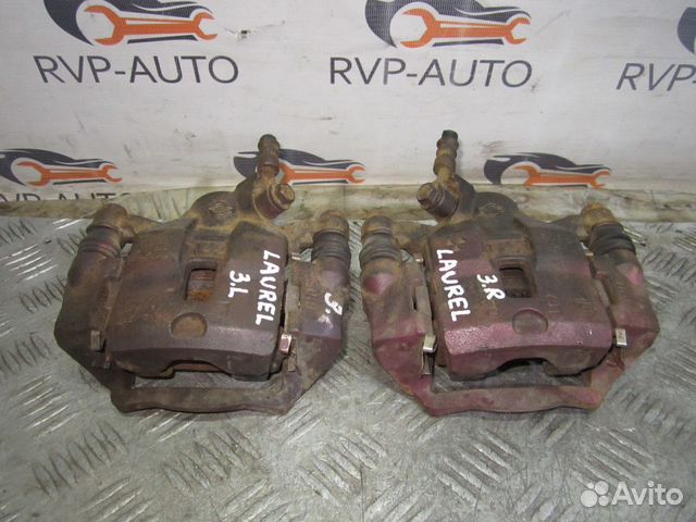 Суппорт тормозной задний Nissan Laurel C35 1997-02