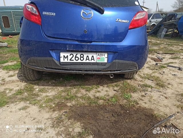 Задний бампер Mazda Demio DE3FS