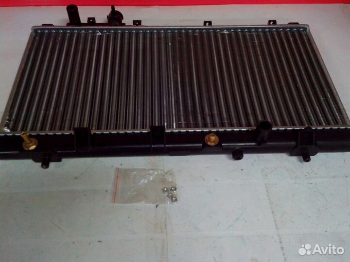 Радиатор Mazda 323 ZL0115200D