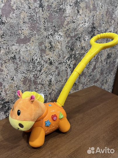 Каталка лошадка музыкальная