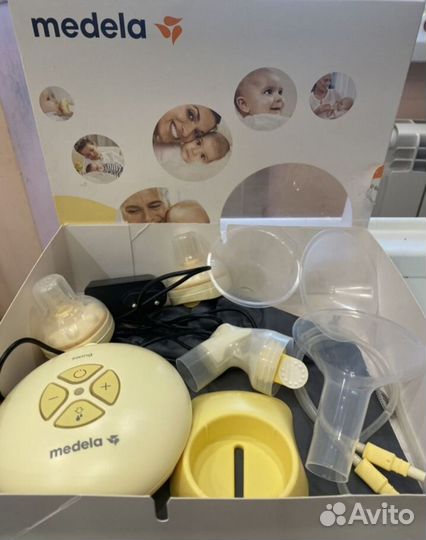 Молокоотсос medela электрический
