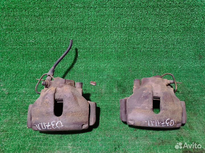 Суппорт тормозной передний Volkswagen Passat