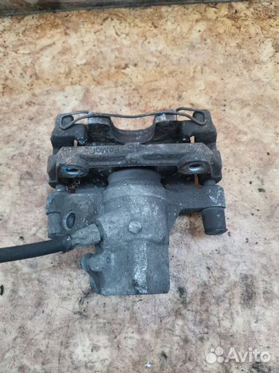 Суппорт тормозной задний левый Ford Focus 2