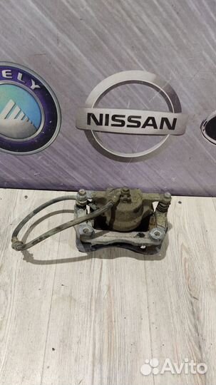 Суппорт тормозной перед Nissan qashqai J10 Лев