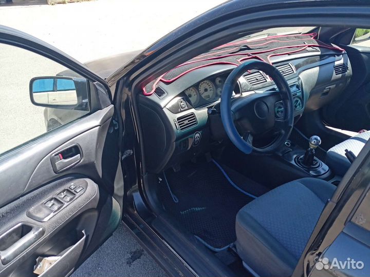 Mitsubishi Lancer Cedia 1.8 МТ, 2002, 100 000 км