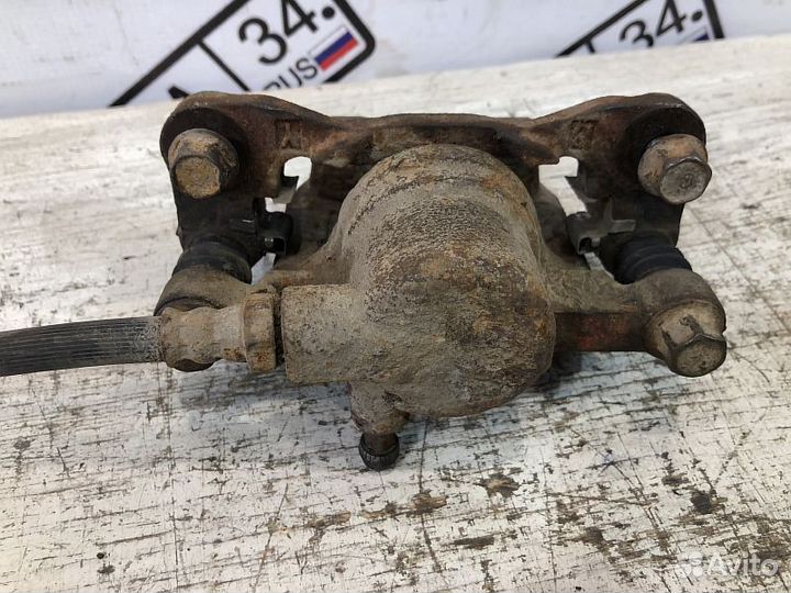 Суппорт тормозной задний Mitsubishi Lancer 9