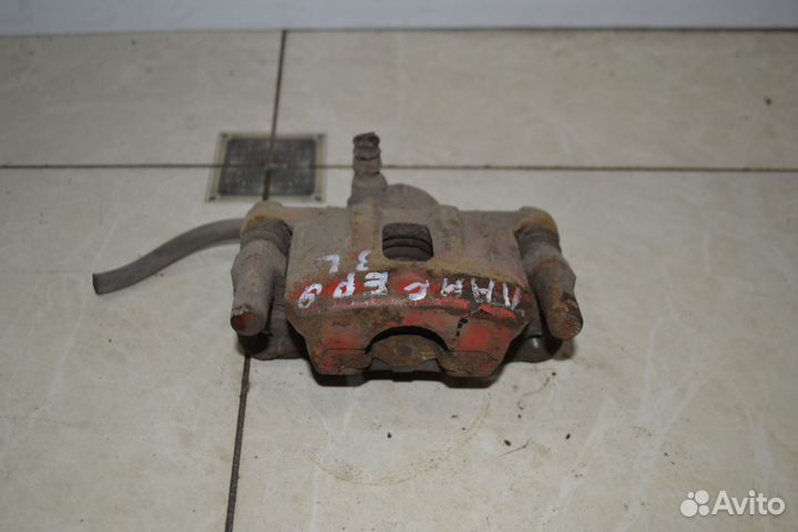 Тормозной суппорт задний левый Mitsubishi Lancer 9