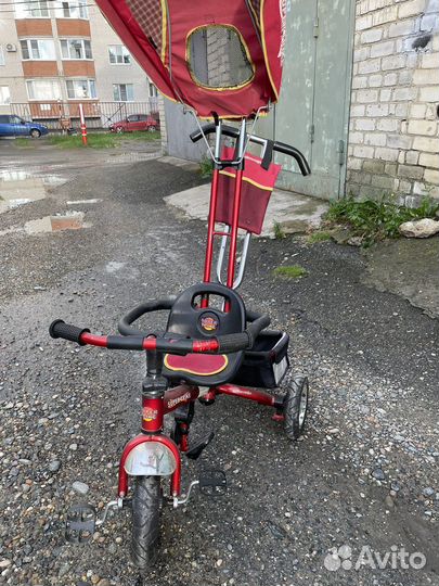 Трехколесный велосипед с ручкой