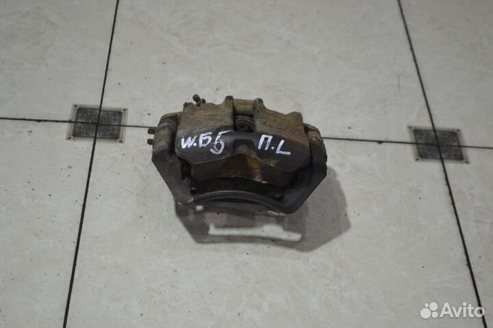 Тормозной суппорт перед лев Volkswagen Passat B5