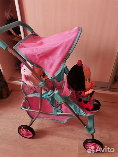 Коляска кукольная с пупсами