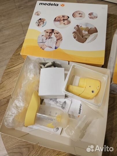 Молокоотсос medela электрический
