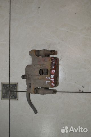 Тормозной суппорт задний левый Mitsubishi Lancer 9