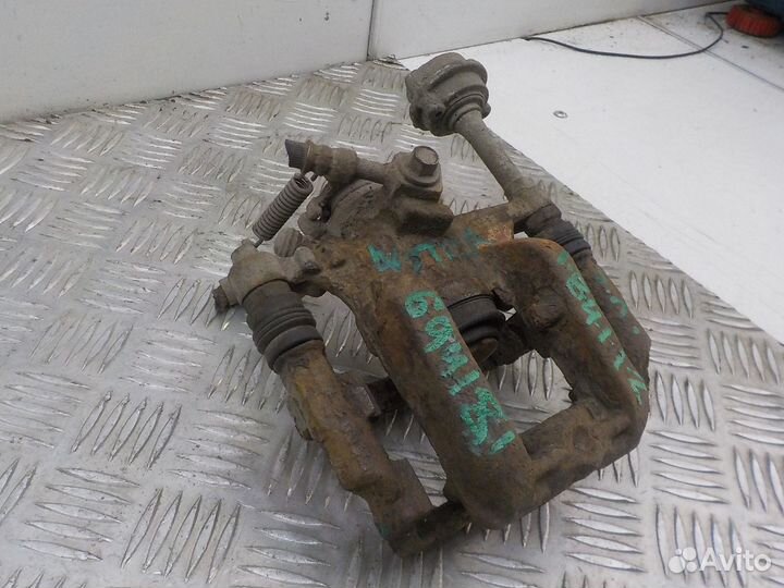 Суппорт тормозной задний левый Opel Astra J 2010