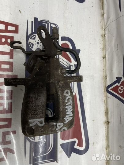 Суппорт задний правый Шкода Суперб / Октавия /Йети