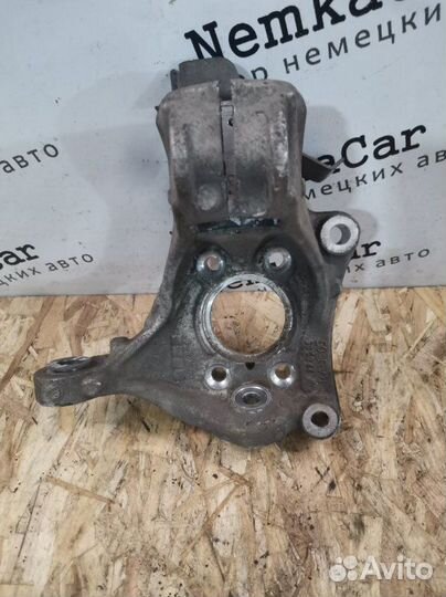 Кулак поворотный передний левый Volkswagen Passat